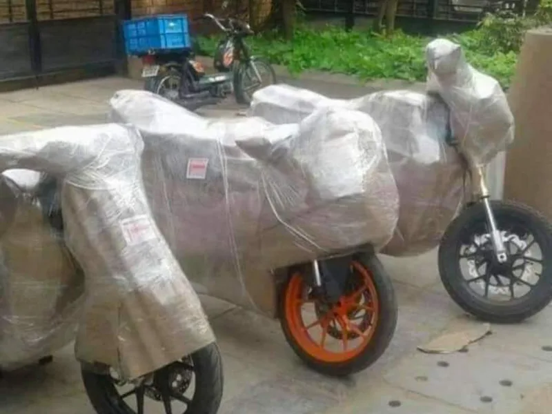 Two motor scooters wrapped with multi-layer bubble cushioning for interstate relocation